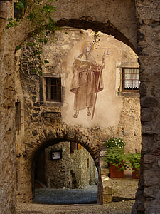 man in brown coat holding bible and staff Religious painting thumbnail