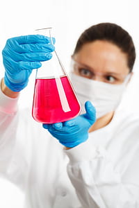person holding glass bottle thumbnail