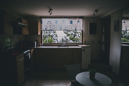room with brown wooden desk, table, and glass window thumbnail
