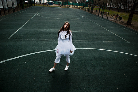 woman wearing white dress standing on court thumbnail