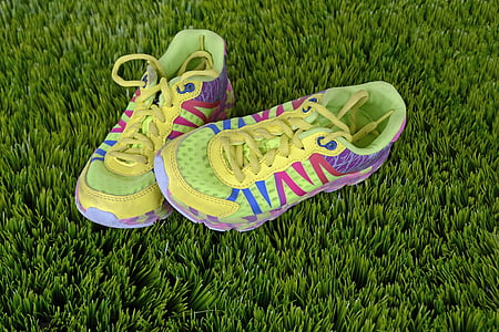 yellow-blue-pink-and-purple sneakers over green grass thumbnail