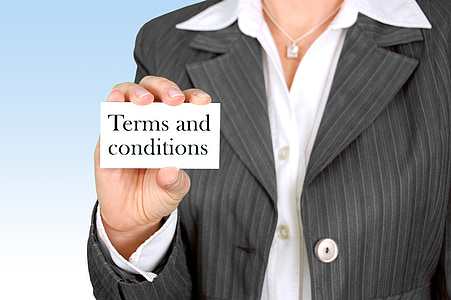 person holding terms and conditions paper thumbnail