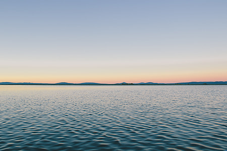 body of sea during golden hour thumbnail