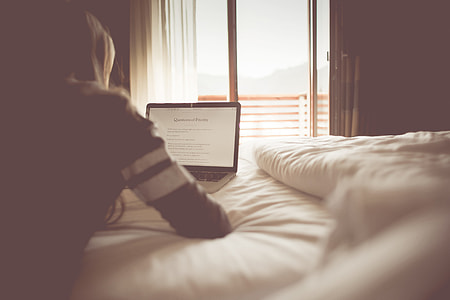 Girl Reading a Blog in a Bedroom thumbnail