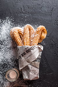 brown fried pastries with powders thumbnail