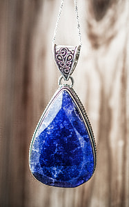 silver-colored necklace with blue gemstone thumbnail