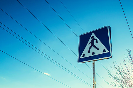 pedestrian signage under blue sky thumbnail