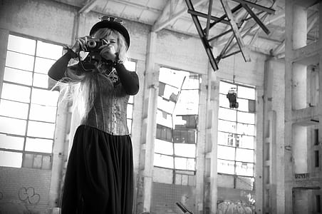 grayscale photo of woman using camera thumbnail