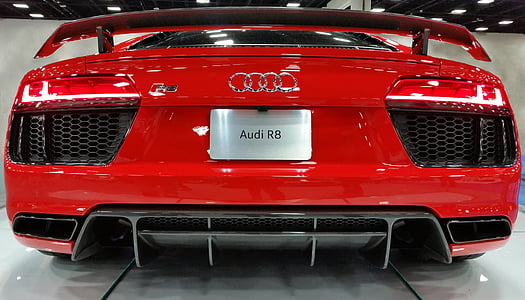 red Audi coupe on white flooring thumbnail