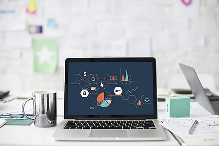 black laptop turned on showing powerpoint template thumbnail