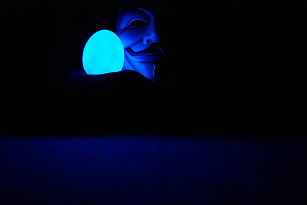Guy Fawk's mask on black background thumbnail