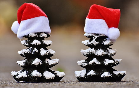 two black-and-white tree ornaments with hats thumbnail
