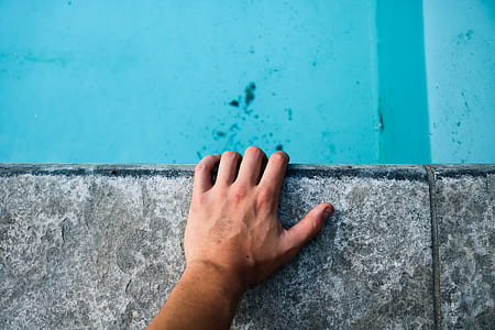 person showing left hand thumbnail