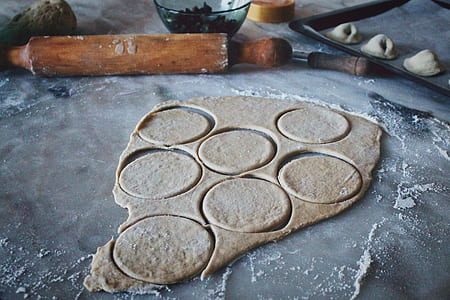 dough beside brown rolling pin thumbnail