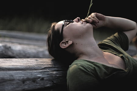 woman leaning on tree log thumbnail