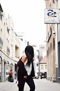 Woman Wearing White Tank Top With Maroon Jacket Crossing N Street thumbnail