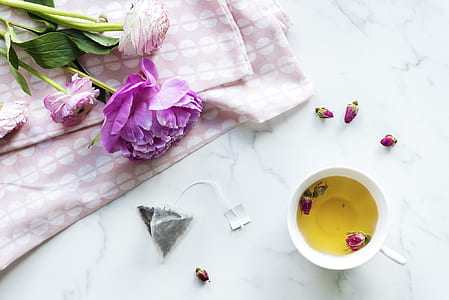 purple flowers and white cup thumbnail