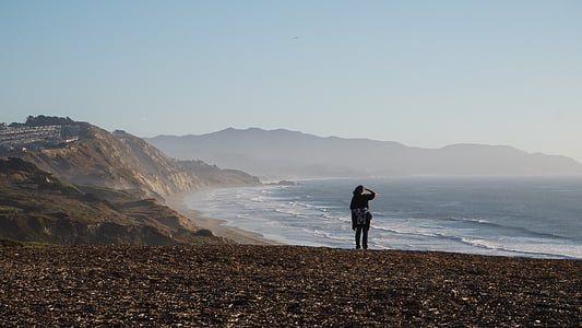 person standing on the seashor thumbnail