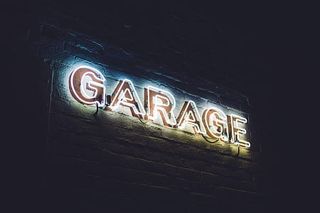 low angle photo of red LED garage sale signage thumbnail