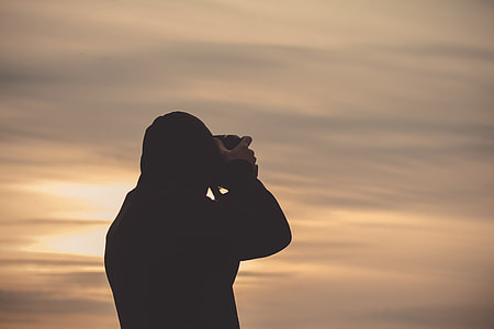 silhouette of person taking pictuer thumbnail