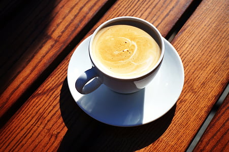 coffee in white ceramic teacup thumbnail