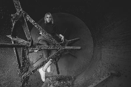 Grayscale Photography of Woman Sitting on Bar thumbnail