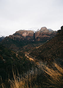 valley near snow capped mountain thumbnail