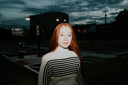 woman wearing white and black striped turtleneck shirt thumbnail