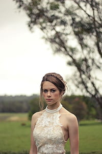 woman in white lace halter top during daytime thumbnail
