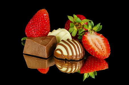 sliced strawberries coated by chocolate and vanilla thumbnail