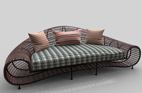 brown wicker sofa with plaid cushion and three throw pillows thumbnail