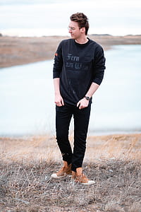 man standing on grass thumbnail