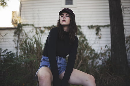 woman sitting beside tree thumbnail