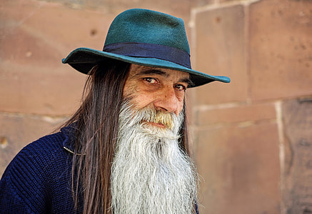 man wearing blue shirt with green fedora thumbnail
