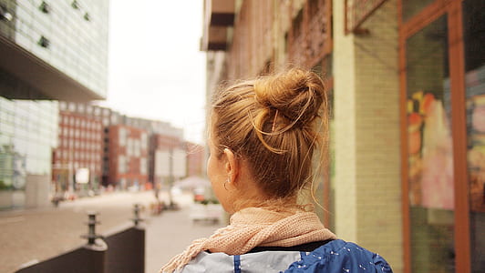 person wearing brown scarf thumbnail