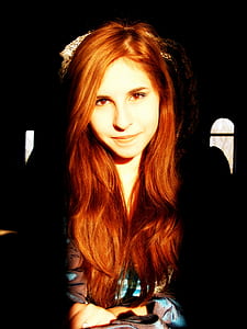 red haired woman in blue and brown shirt thumbnail