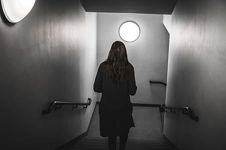 woman walking on stairs with light turned-on thumbnail