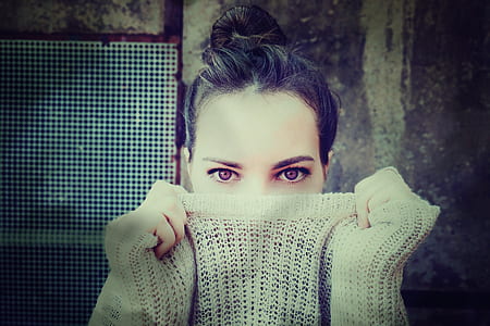 woman covering half of her face thumbnail