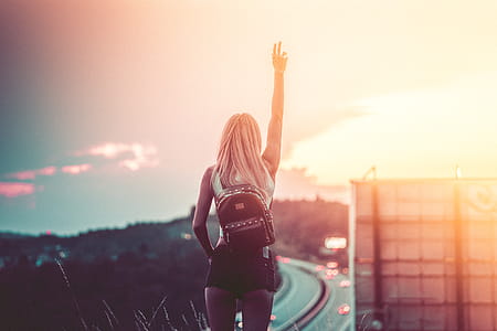 Young Woman Enjoying Freedom in the Summer Evening thumbnail