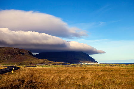brown mountain covered in cloud thumbnail