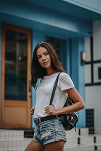 woman wearing white top outside thumbnail