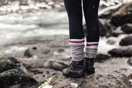 person standing on grey stone thumbnail