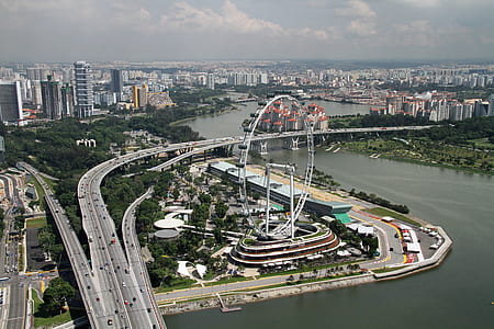 bird's eye view photography of bridge near amusement park thumbnail