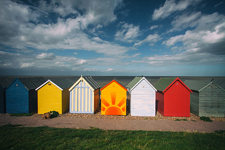 Wide-angle capture of some coastal beach huts on a summer day, image captured in Kent, England thumbnail