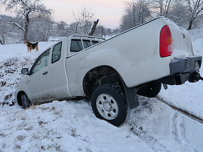 white pickup truck parked on snow covered ground during daytime thumbnail
