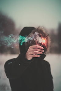 man holding firecracker thumbnail
