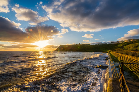 seashore under cumulus clouds in sky thumbnail