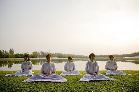 five women meditates near water thumbnail