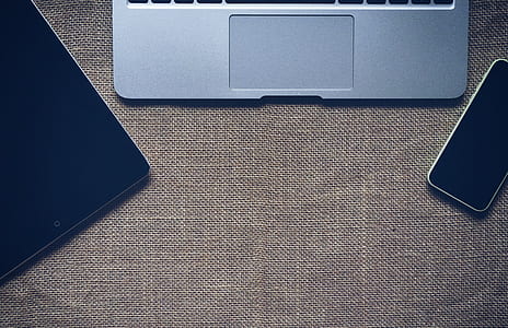 Macbook Pro Near White Iphone 5c and Black Ipad thumbnail