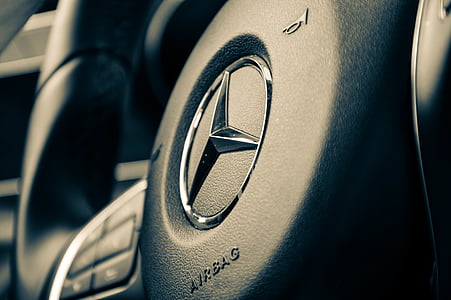 closeup photo of black Mercedes-Benz multi-function vehicle steering wheel thumbnail